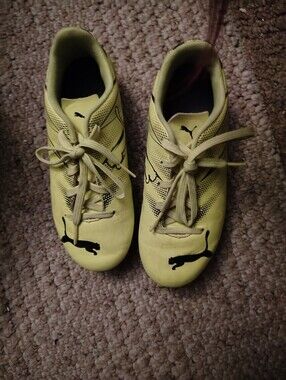 Puma Kids Yellow Soccer Cleats with Black Puma Logo